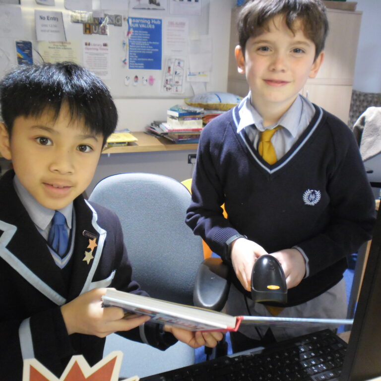 students scanning a book