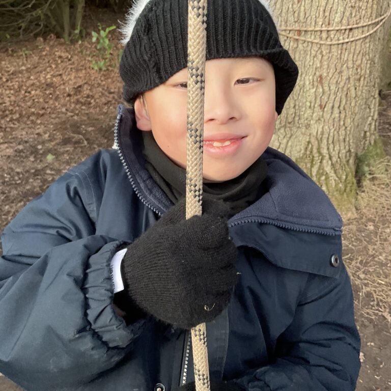 a student holding a rope