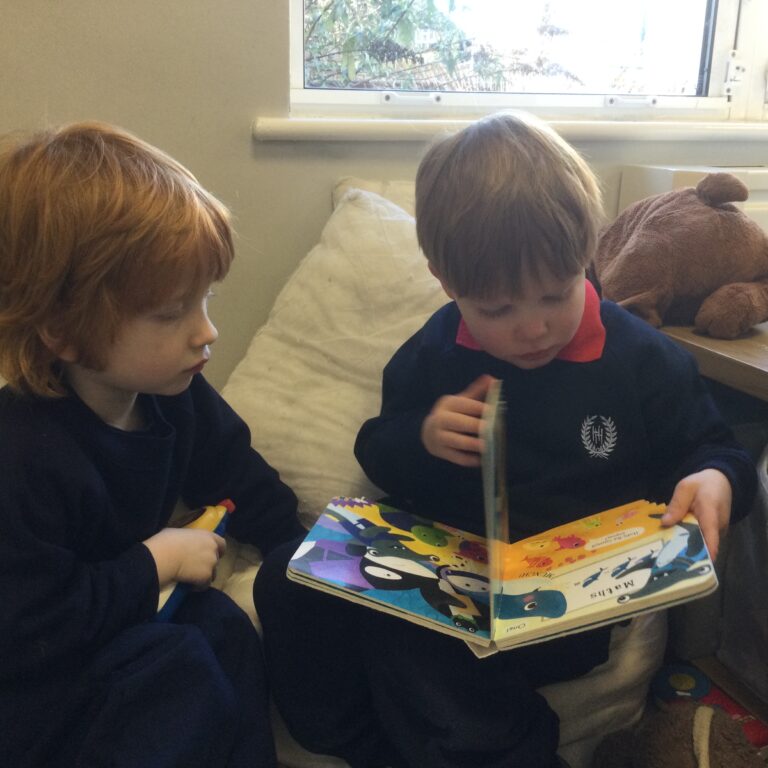 boys reading a book