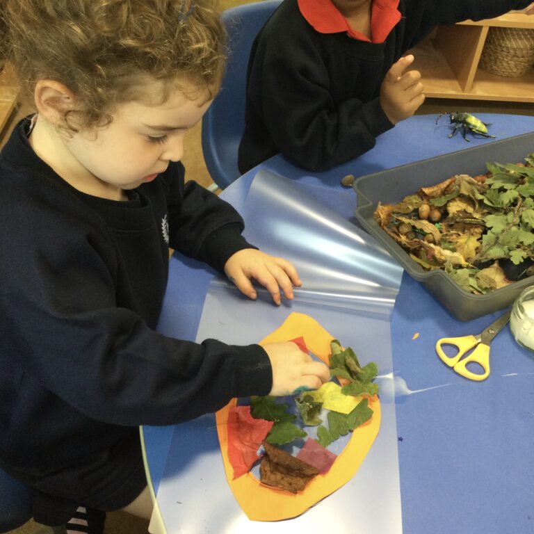 little girl making a collage